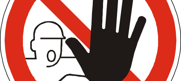 A do not use sign signified by a cartoon man showing his hand within a red circle with a red line dividing it in two